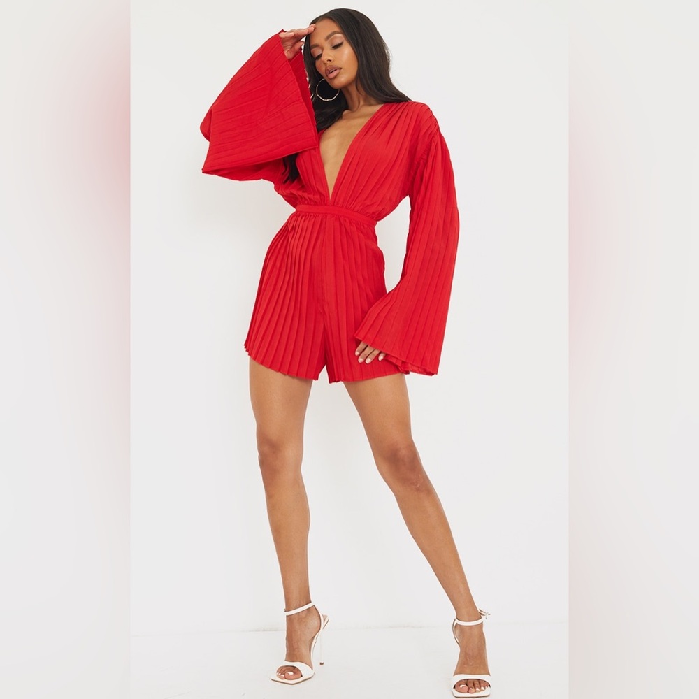 PRETTY LITTLE THING: RED PLUNGE PLEATED ROMPER; SIZE 4